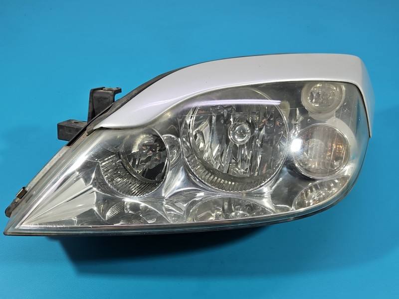Фара передняя левая Nissan Primera 1EJ238010-01
