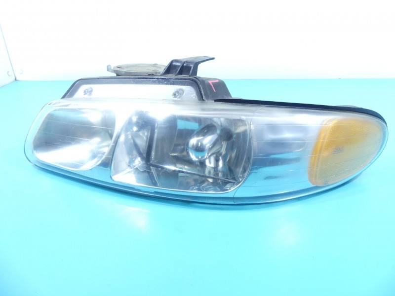 Фара передня ліва Chrysler Voyager